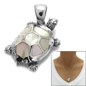 CHARMING AND LUMINOUS STERLING SILVER TURTLE WITH TURTLE SHELL PENDANT.